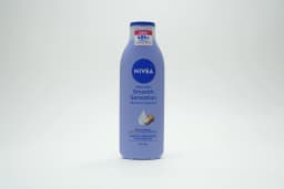 Nivea Triple Action Body Lotion 250 ml - image 1